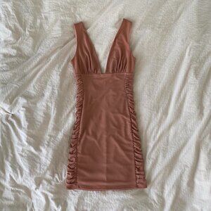 mini dress with ruffles on the sides and a V neckline